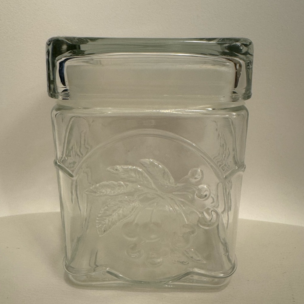 Vintage clear glass canister. Embossed fruit design